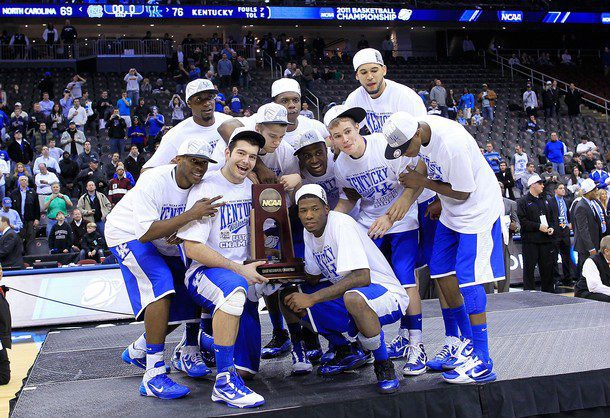 The Kentucky Wildcats celebrate with the trophy after defeating the North Carolina