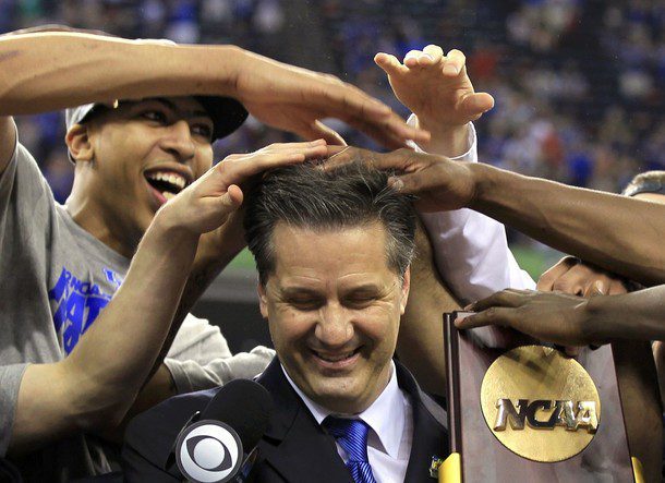 Kentucky Wildcats forward Anthony Davis messes up the hair of head coach John Calipari as he holds the championship trophy after the Wildcats defeated the Kansas Jayhawks in the men's NCAA Final Four championship college basketball game in New Orleans